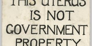 [Placard for the Abortion Caravan with message "This uterus is not government property"]