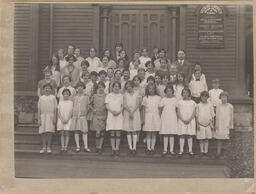 Group photo of young girls in front of the Methodist Church