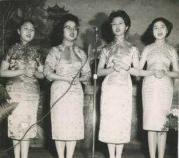 [Singing performance of four female students]