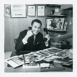 Syd Freedman holding two phones