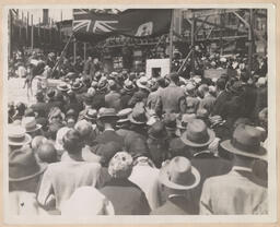 Crowd in front of church construction scaffolding