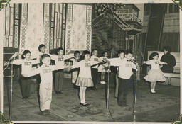 [Performance of young students on stage]