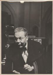 Virgil Fox in suit looking beyond the camera