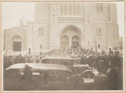 Crowds entering as the church doors open