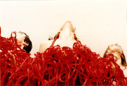 Photograph of She Said Performance with Red Fabric Strips