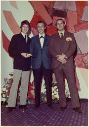 Syd Freedman standing between two men at an event