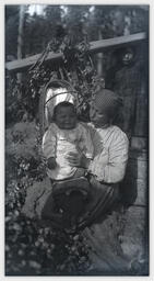 Woman hop picker with baby