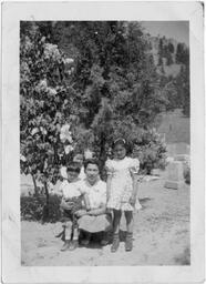 Joe, Mary, and Shirley visit the cemetary with their mother