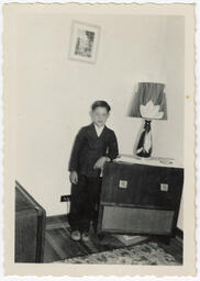 Joe takes his photo beside a lamp