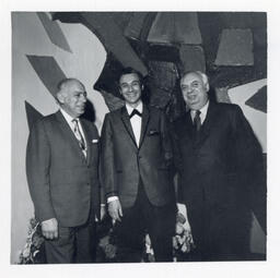 Syd Freedman standing between two men