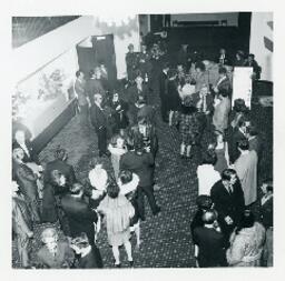 People mingling in the lobby of Lougheed Mall Cinemas