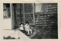 Young Mary and Shirley on the front porch