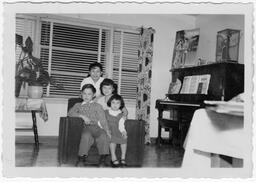 The kids pose for a photo in the living room